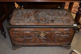 Mid to late 20th century Oriental camphor wood coffer, typically carved, 83.5cm wide