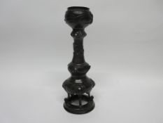 Oriental bronze candlestick with applied decoration of turtles and dragons, 31cm high