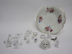 Porcelain plate and a group of Swarovski glass figures including a puffer fish, a poodle, and others