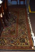 Large Caucasian style wool carpet, multi-gull border, central panel of flowering foliage, mainly