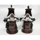 Pair of 20th century pottery book ends, the terracotta bodies brown glazed modelled as judges seated