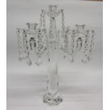 Glass candelabra of faceted form with four sconces with droplets hanging from each sconce, 48cm