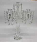 Glass candelabra of faceted form with four sconces with droplets hanging from each sconce, 48cm