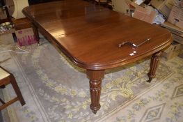 Victorian mahogany wind-out extending dining table, moulded edge and fluted supports terminating