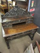 Victorian oak Gothic style desk, the pediment decorated with C-scrolls, foliage etc, the back with