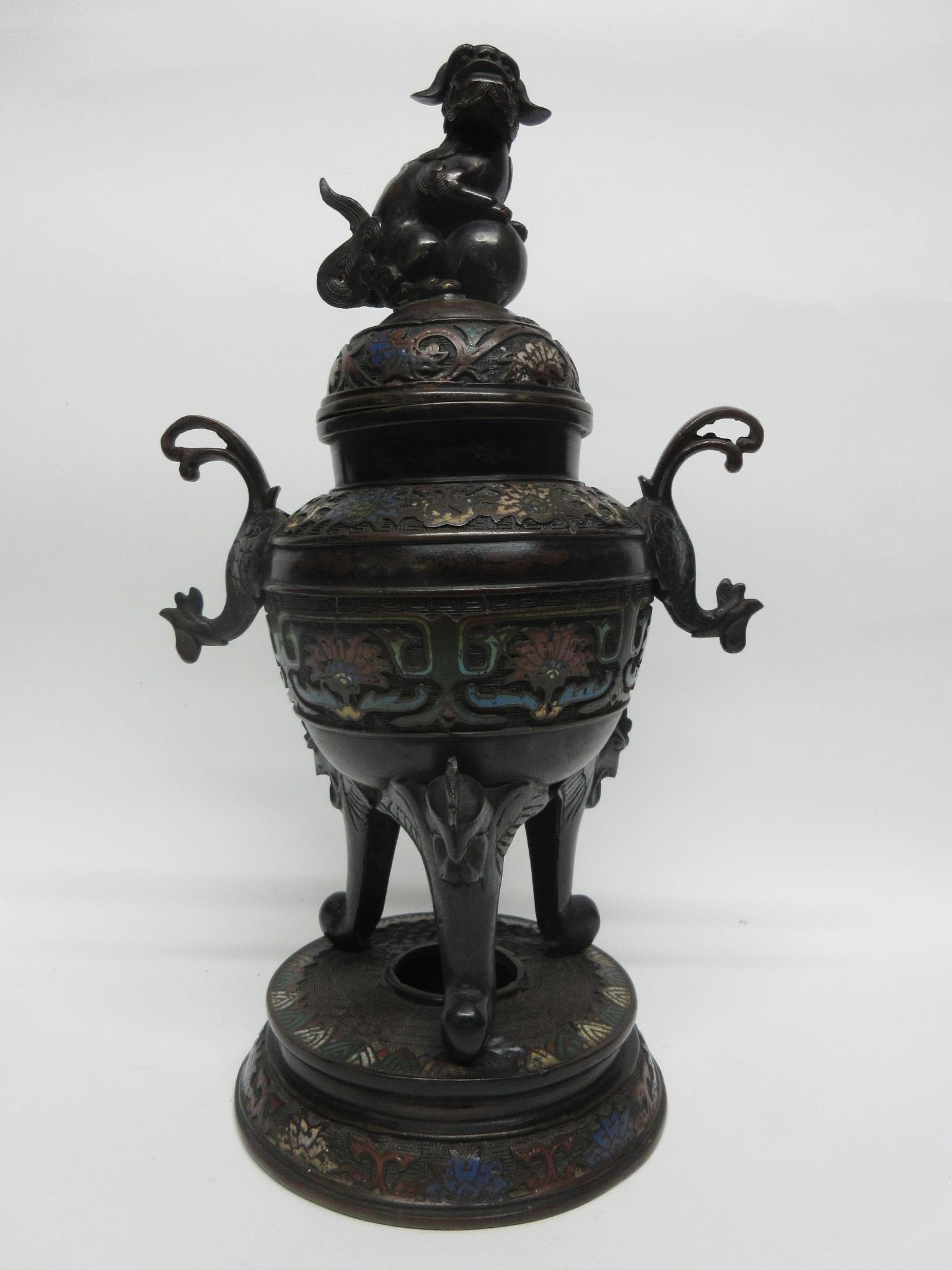 Large metal bronzed jar and cover with lion finial, decorated in cloisonne style, standing on