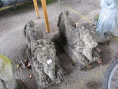 PAIR OF COMPOSITION RECUMBENT LIONS