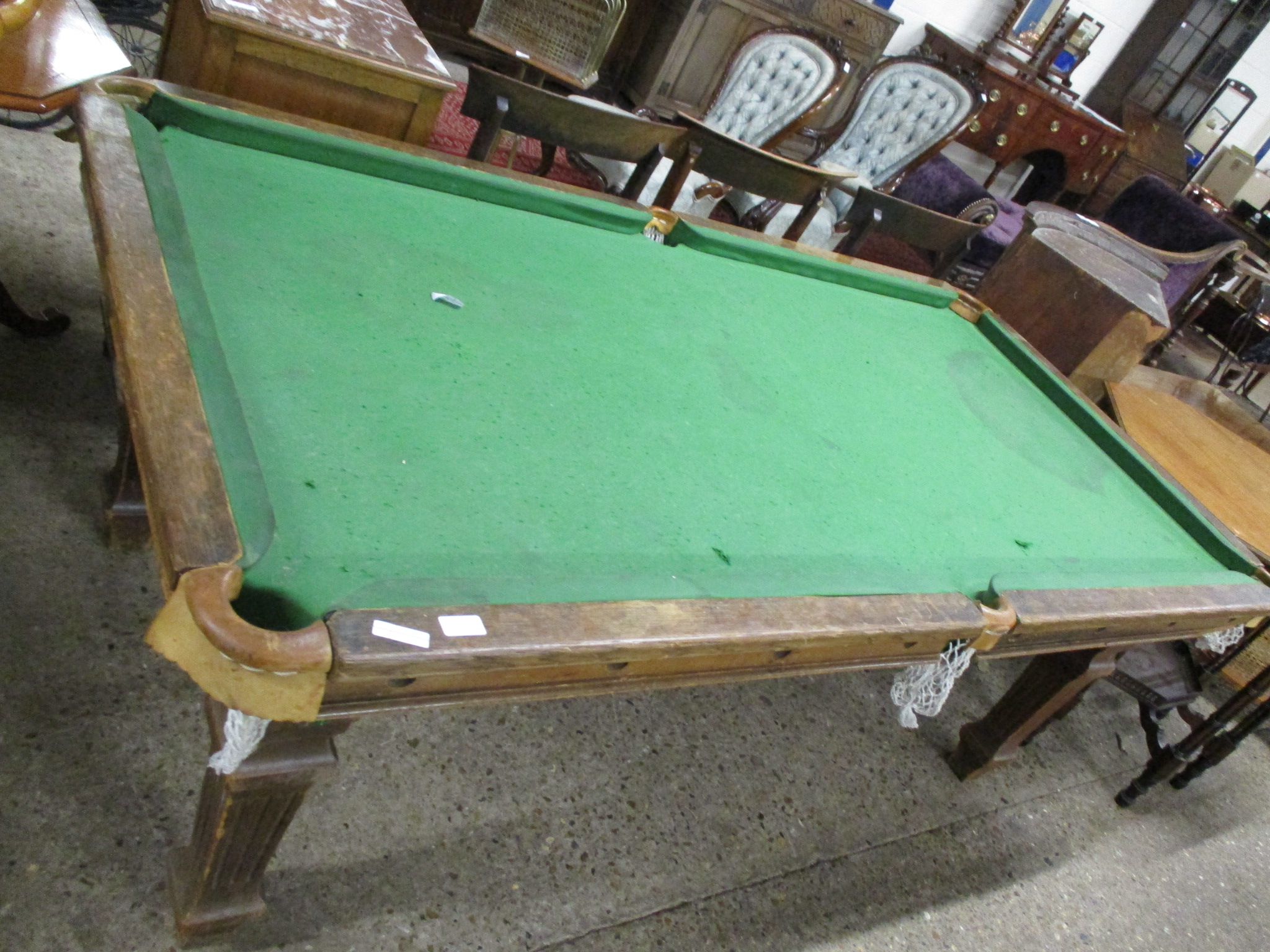 AN OAK BILLIARD TABLE RAISED ON FLUTED SQUARE SUPPORTS, 195CM LONG