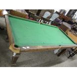 AN OAK BILLIARD TABLE RAISED ON FLUTED SQUARE SUPPORTS, 195CM LONG