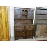 REPRODUCTION DARK OAK DRESSER, THE BACK WITH LEADED GLAZED COMPARTMENTS, 115CM WIDE