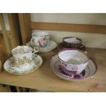 FOUR DECORATIVE CUPS AND SAUCERS