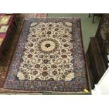 Iranian hand woven wool carpet with a floral design on cream with pale blue border 390 x 300 cm