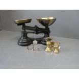 Set of iron weighing scales with brass pan & set of cast brass weights