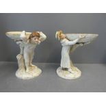 Pair of Worcester figures with a young man and girl supporting bowls 21cmH x 17cmW x 17cm D