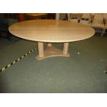 A good quality, large circular contemporary dining table, with triple pedestal united legs to