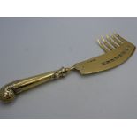 Unusual Edwardian silver gilt server with curved pierced blade & five prong extension, having a leaf