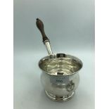Early George III silver brandy saucepan, with turned wood handle to the ogee sides engraved with