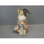 An ornate vase with a sea eagle on a globe 15H x 13W cm