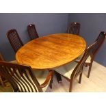 An oval shaped dining table and six dining chairs. Dining table: 180cmW