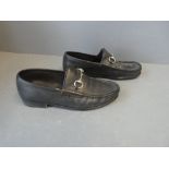 Pair of gents black leather GUCCI loafers with silver buckle, slightly worn size 42 E