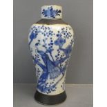 Blue and White crackle glaze vase decorated with a peacock in a tree. 26cm H x 12cm W