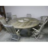 Large outdoor circular teak garden table and 6 chairs: 76cmH x 210cm diameter