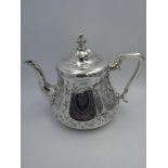 Victorian silver teapot with engraved panelled sides, crested & monogram cartouches, capped