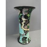 Famille vert vase decorated with a stylised crane on a black ground 32.5cmH x 18cm D
