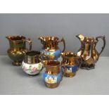 Collection of Victorian copper lustre jugs (6)
