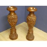 Two carved wooden urns 80cm height