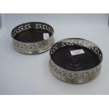 Pair of George III silver wine coasters, side with pierced, engraved & crested fine bead edge, baize