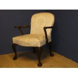 A good mahogany framed arm chair with claw and ball feet, upholstered in a pale fabric 92H x 74W x