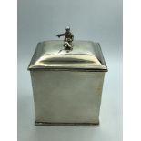 Rectangular silver tea caddy with beaded borders, the lid with detachable Oriental figure, by John