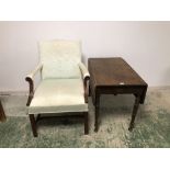 Drop leaf table and large open framed armchair upholstered in a white fabric