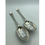 Pair of George III Scotish silver Hanoverian pattern table spoons, engraved a crest with motto by