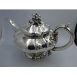 William IV silver everted melon panelled circular teapot, the hinged lid with detachable cast