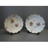 Pair of white floral dishes with a distinct mark to base 22cm diameter