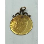 George IV gold guinea with 9ct soldered mount 8g