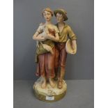 Royal Dux group ornament of a loving young couple holding a lamb 40cmH x 23cmW