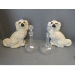 Two ornamental dogs and two decanters