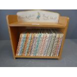 A peter rabbit bookshelf With a collection of peter rabbit books