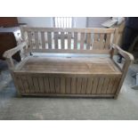 Outdoor garden bench with hinged seat and storage underneath and cover, as found. 93cm H x 151cm W x