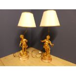 Pair of substantial gilt metal figurine table lamps on marble/onyx bases