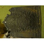 Large fire back with armorial & cherub design. Purchaser please note: heavy item, which requires 2