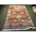Contemporary rug with cream diamond pattern to central light red ground panel, size 232L x 158W cm