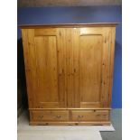 Pine wardrobe with drawer at the base