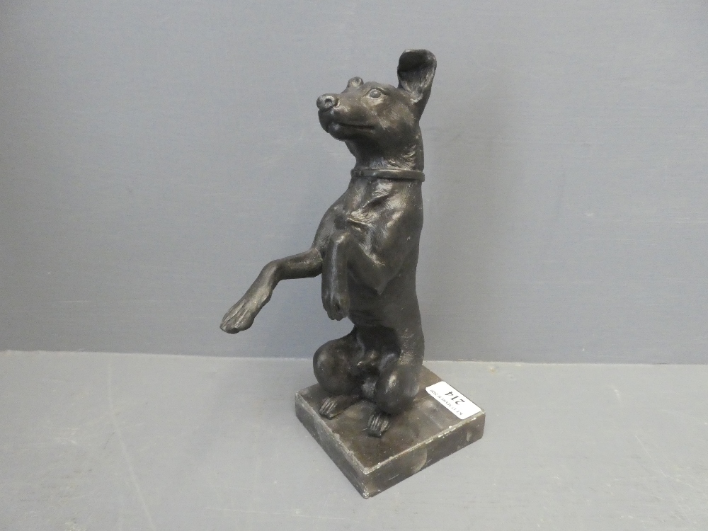 A standing bronze in the form of a Terrier on its hind legs, on square plynth base