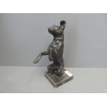 A standing bronze in the form of a Terrier on its hind legs, on square plynth base