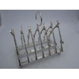Silver plated toast rack in the form of rifles
