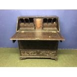 Central European oak bureau with 4 drawers, profusely carved with naive scenes of hunting, the